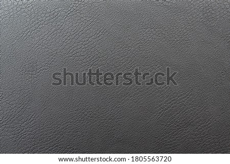 Black or dark gray leather as texture, background