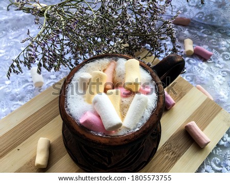 cappuccino in earthenware with marshmallows