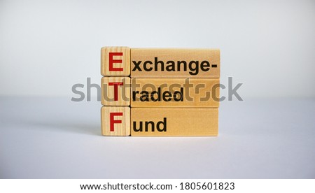 Concept words 'ETF,  Exchange-Traded Fund' on cubes on a beautiful white background. Business concept. Copy space.