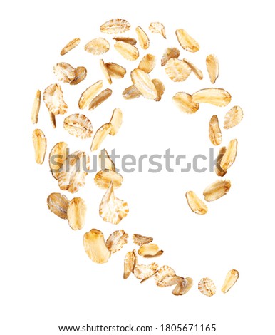 Oat flakes frozen in the air close-up isolated on a white background Royalty-Free Stock Photo #1805671165