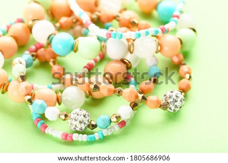 Beautiful bracelets on green background