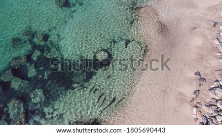Drone picture sea with beach from above with clear water and stones in Mallorca