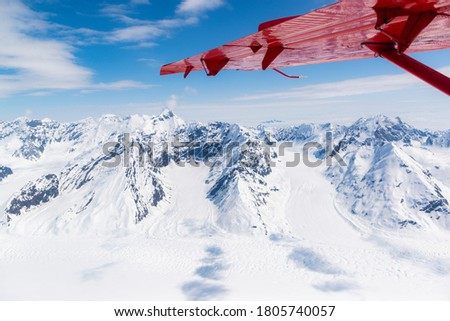 Flight seeing in the Denali National Park on a small ski plane. The plane leaves from Talkeetna, Alaska. Royalty-Free Stock Photo #1805740057