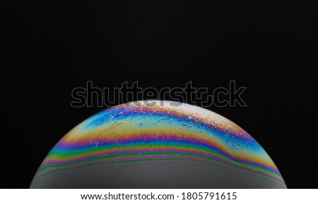 Close-up of soap bubble film in various colors