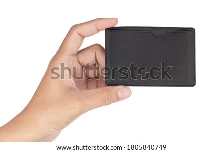 Hand holding Pouch Leather Business Card isolated on a white background.