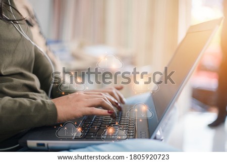 A teenage woman cloud notebook computer concept publishes information, indicating online storage and Internet connection. Royalty-Free Stock Photo #1805920723