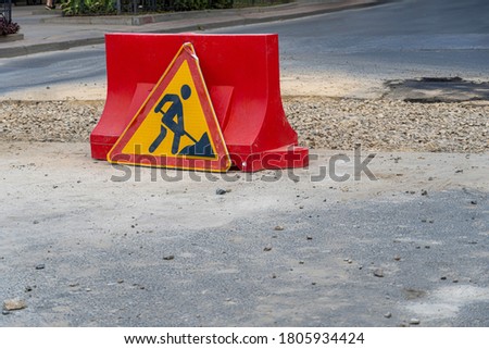 Road repair caution work in progress sign
