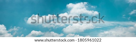 Clouds in the Blue Sky on Sunny Day, Nature Scenery with a Good Weather. Looking Up Shot. Long and Wide Screen