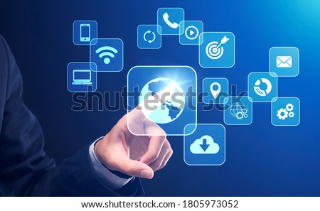 Business Technologies. Businessman pushing button on digital screen interface with various web icons