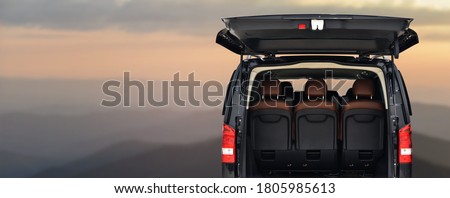 Transfer on minibus to nature in mountains Royalty-Free Stock Photo #1805985613