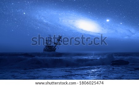Sailing old ship in storm sea Andromeda galaxy in the background "Elements of this image furnished by NASA