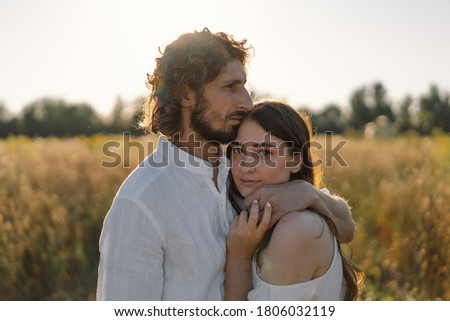 A loving couple hug in nature. Being happy together. Happy Summer