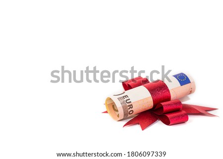 euro bank note with red ribbon on white background, money Christmas decorative image for holiday money saving concept.