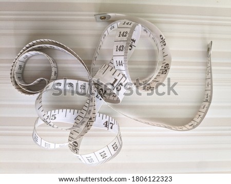 messy white tape measure stock photo