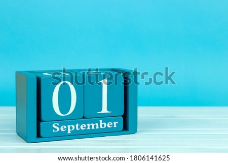 wooden calendar with the date of August 1 on a blue wooden background, World letter day	
