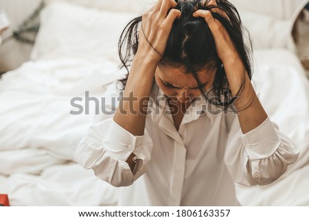 Single mother Feeling overwhelmed and anxious about raising their children During the long weekend. Royalty-Free Stock Photo #1806163357