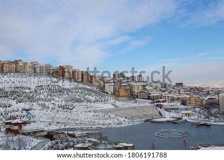 a city and a lake under the snow