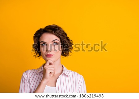 Photo of minded girl look up copyspace hand chin think wear striped white clothes isolated over yellow color background Royalty-Free Stock Photo #1806219493