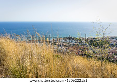 Beautiful Italian landscape. Seaside resort San Felice Circeo with small port and long sandy beach. Blue Mediterranean sea with many boats and ships. Summer holiday in Italy. Royalty-Free Stock Photo #1806222151