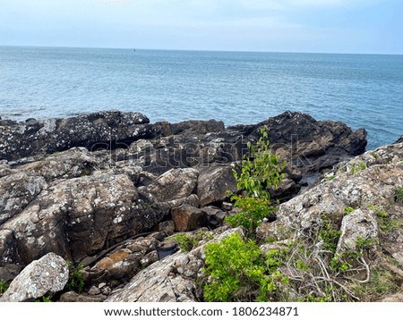 Landscape photo of rocky stone shoreline of lake michigan