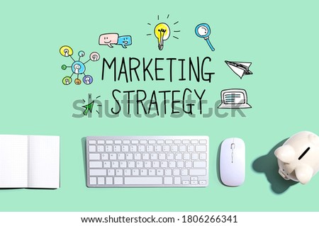 Marketing strategy with a computer keyboard and a piggy bank