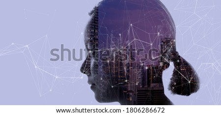 Double exposure of Asian woman silhouette and modern renewable city skyline background.Energy Digitalization concept.