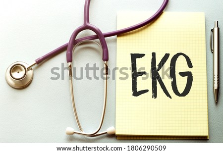 On a purple background a stethoscope with yellow list with text EKG