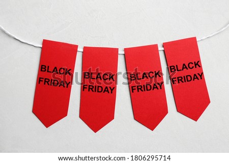 Word SALE made with red tags on light grey background, flat lay. Black Friday concept