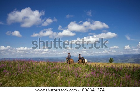Horseback riding in the Carpathian mountains.