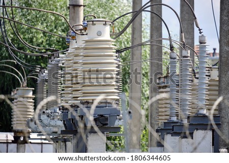 Power current transformer at a power plant Royalty-Free Stock Photo #1806344605