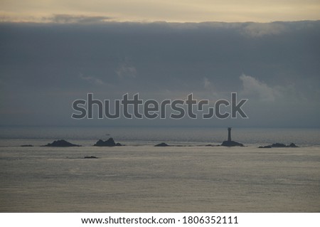 Lighthouse and approaching storm clouds