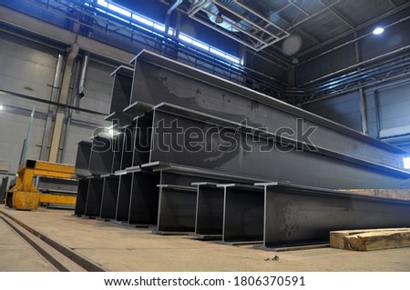 products of the plant for the production of metal structures. Welded I-beam Royalty-Free Stock Photo #1806370591
