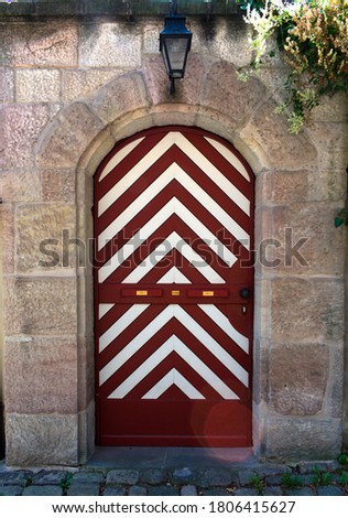 Medieval door in white and red colors, Nuremberg, Germany