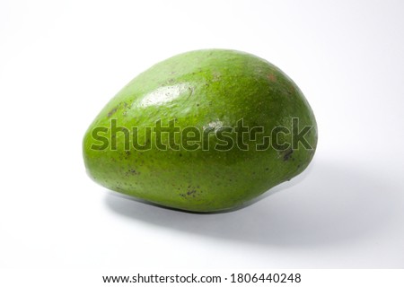Green avocado with white background. Tropical fruit.