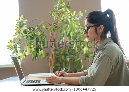 Indian woman online teacher, student, remote worker video conference calling, watching webinar training working studying at home office classroom. Female tutor giving webcam online class on laptop. Royalty-Free Stock Photo #1806447925