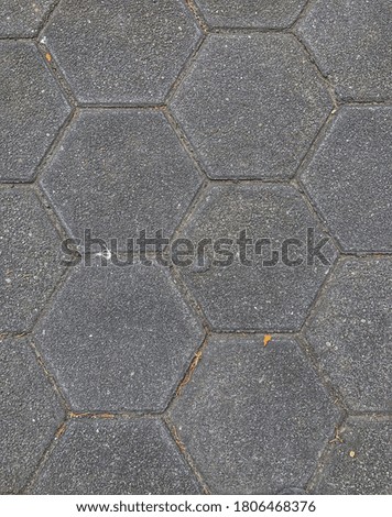 paved floor on the sidewalk of a street