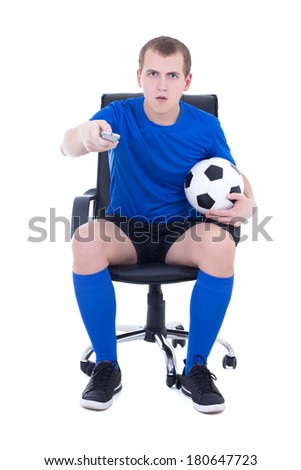 shocked man in uniform with remote control watching soccer game isolated on white background