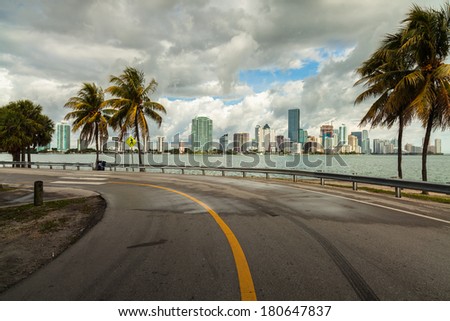 Beautiful Miami skyline along Biscayne Bay with rain clouds.