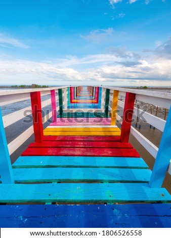 Rainbow Bridge and seaside bridge, bright colors, eye-catching contrast with the clear blue sky and a panoramic view of the sea Royalty-Free Stock Photo #1806526558