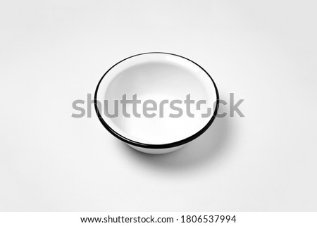 Enamel plate, or bowl, isolated on white background.High resolution photo.