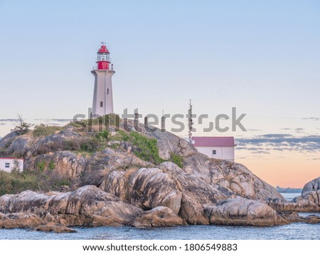 A charming lighthouse during summer sunset in Vancouver Canada.