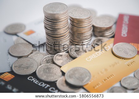 Coins with credit card and card visa and bank notes on the white background for finance and banking , Saving ideas and investment budget, Creative ideas concept of saving money