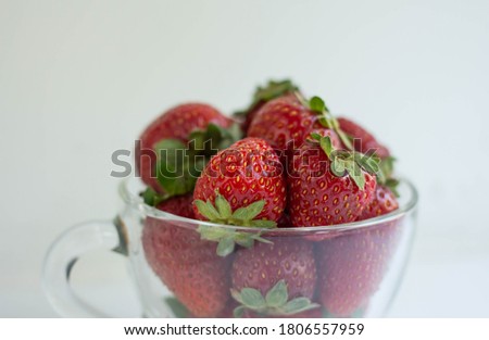 fresh strawberry in glass cup.