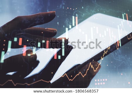 Abstract creative financial graph with world map and with finger clicks on a digital tablet on background, forex and investment concept. Multiexposure Royalty-Free Stock Photo #1806568357