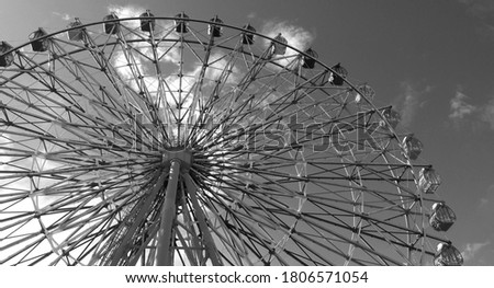 The top floor of the shopping mall, the Ferris wheel and the blue sky(Black and white photo)