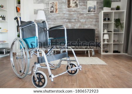 Wheelchair parked in hospital private room for patient with mobility disability. No patient in the room in the private nursing home. Therapy mobility support elderly and disabled walking disability Royalty-Free Stock Photo #1806572923