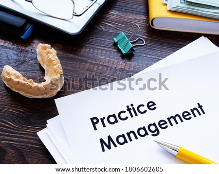 Dental practice management guidelines on the desk. Royalty-Free Stock Photo #1806602605
