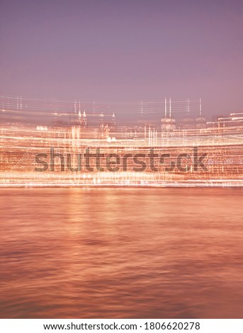 Motion blurred picture of Manhattan skyline at night, abstract urban background, color toned picture, New York City, USA.