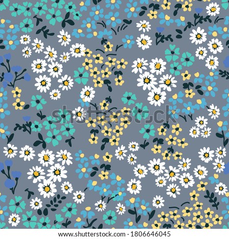 Small summer flowers on grey background. Seamless vector pattern. Vintage print with 
 inflorescences. Retro textile collection. Royalty-Free Stock Photo #1806646045