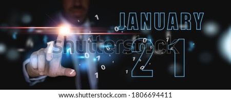 january 21st. Day 20 of month, advertising or high-tech calendar, man in suit presses bright virtual button winter month, day of the year concept.
